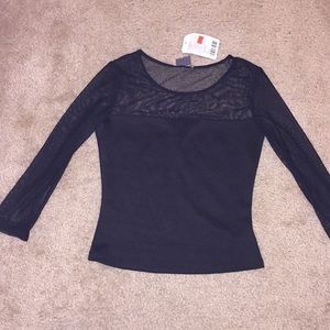 Black top with mesh neckline and sleeves.
